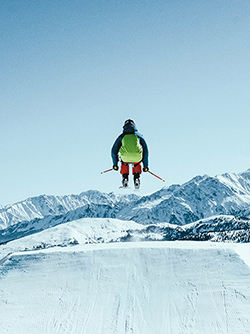 picture of a person skijumping in the mountains